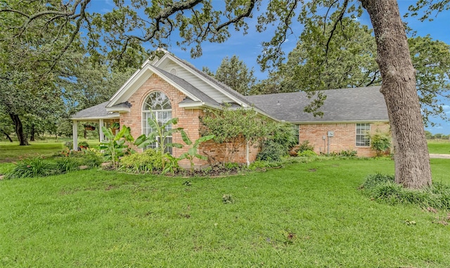 130 Vz County Road 3509, Edgewood, TX 75117 - view of front of house featuring a front yard, brick siding, and roof with shingles