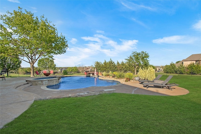 view of swimming pool with a patio, a yard, and a pool with connected hot tub