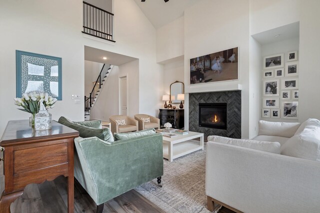 3340 Cabin Crest Pl, Frisco, TX 75033 - living area featuring stairs, a fireplace, wood finished floors, and high vaulted ceiling