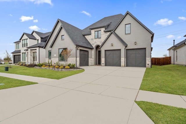 3340 Cabin Crest Pl, Frisco, TX 75033 - french country style house with stone siding, driveway, roof with shingles, and brick siding