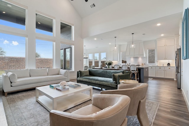 3340 Cabin Crest Pl, Frisco, TX 75033 - living room featuring wood finished floors, recessed lighting, baseboards, and high vaulted ceiling