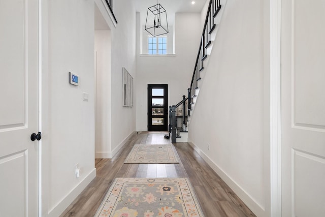 3340 Cabin Crest Pl, Frisco, TX 75033 - entrance foyer featuring healthy amount of natural light, light wood finished floors, stairs, a chandelier, and a towering ceiling
