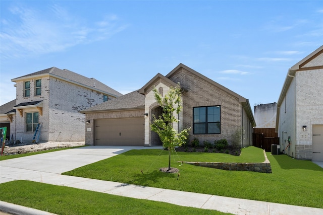 216 Whitetail Dr, Aledo, TX 76008 - french country inspired facade with brick siding, a garage, driveway, and a front yard