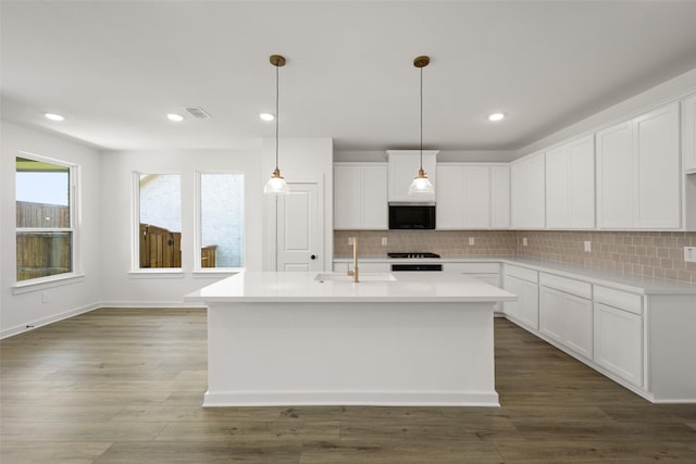216 Whitetail Dr, Aledo, TX 76008 - kitchen with stainless steel microwave, backsplash, light countertops, and recessed lighting