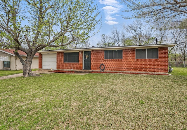 ranch-style house with fence, a front yard, brick siding, an attached garage, and driveway