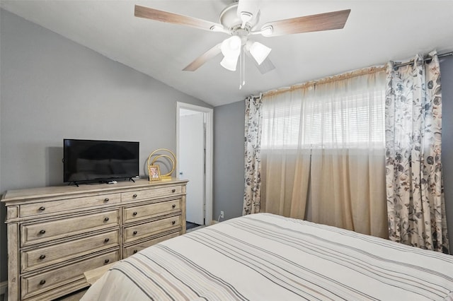 bedroom with ceiling fan and vaulted ceiling