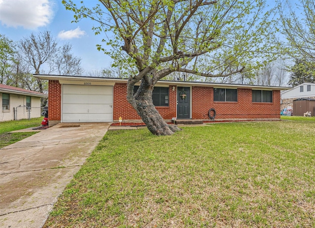 single story home with brick siding, driveway, a front yard, and a garage
