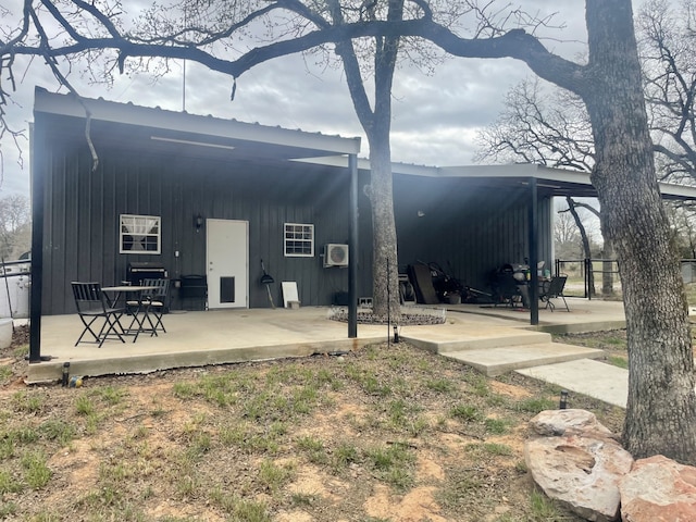 back of house with a patio