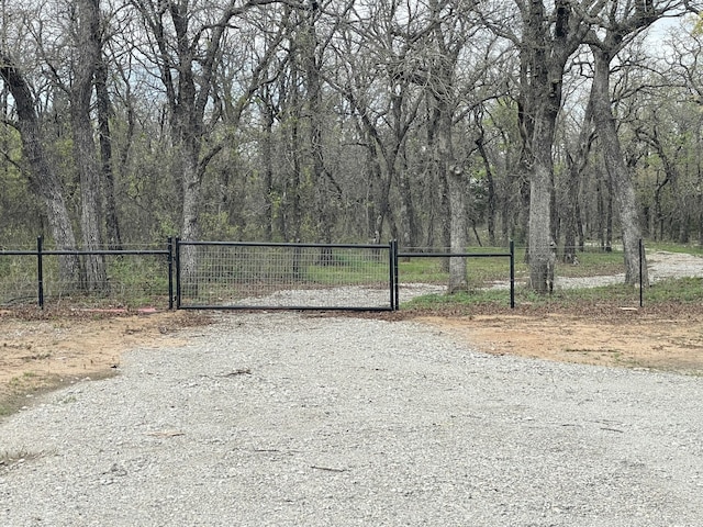 view of gate with fence
