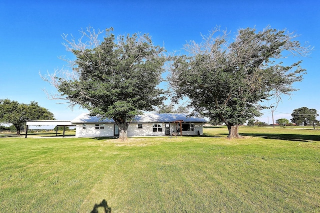 2432 Cottondale Rd, Springtown, TX 76082 - back of property with a yard and a carport
