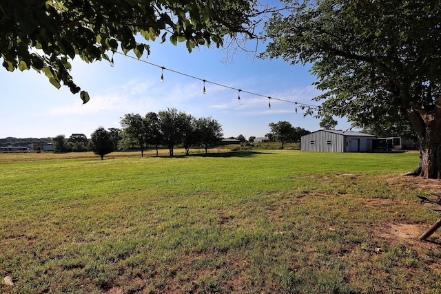 2432 Cottondale Rd, Springtown, TX 76082 - view of green lawn featuring an outbuilding and an outdoor structure