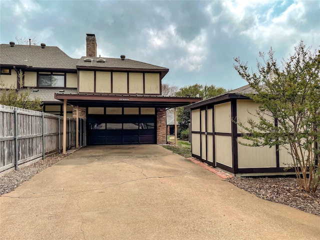 2505 Skipwith Dr, Plano, TX 75023 - exterior space with fence, an attached garage, brick siding, concrete driveway, and a chimney