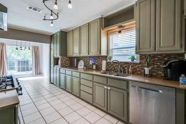 3929 Collinwood Ave, Fort Worth, TX 76107 - kitchen featuring dishwasher, a sink, light tile patterned floors, backsplash, and green cabinetry