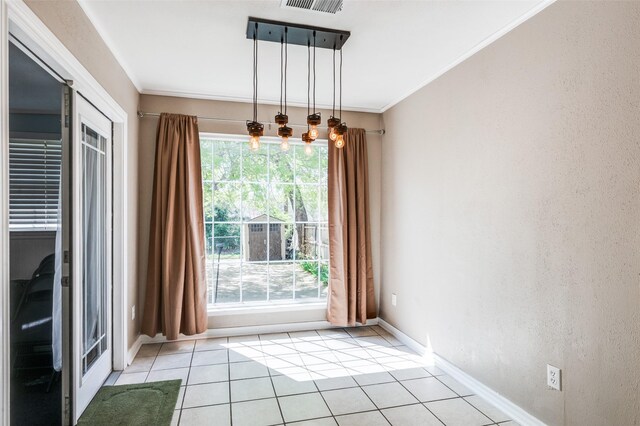 3929 Collinwood Ave, Fort Worth, TX 76107 - unfurnished dining area with ornamental molding, light tile patterned floors, baseboards, and a textured wall