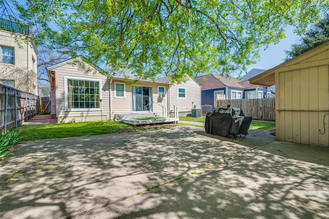 3929 Collinwood Ave, Fort Worth, TX 76107 - back of property featuring a patio area, a fenced backyard, and central AC
