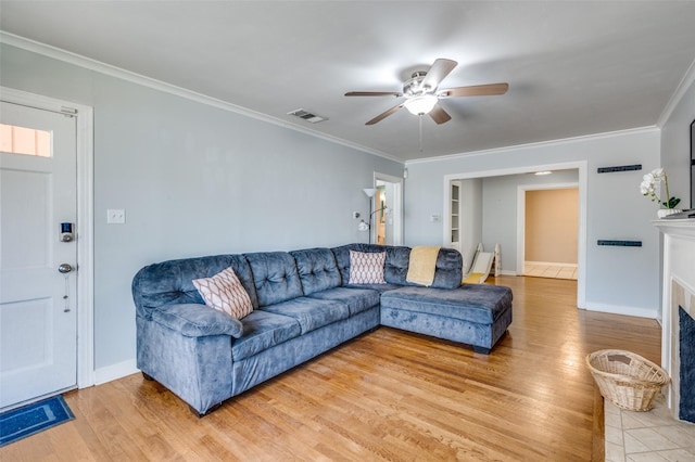 3929 Collinwood Ave, Fort Worth, TX 76107 - living room featuring light wood-style floors, ceiling fan, crown molding, built in shelves, and baseboards