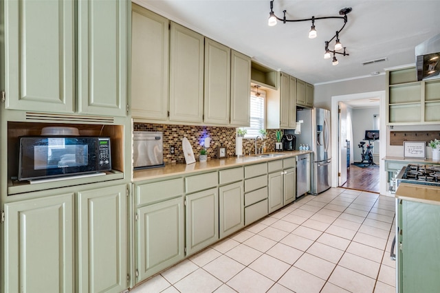 3929 Collinwood Ave, Fort Worth, TX 76107 - kitchen with appliances with stainless steel finishes, open shelves, light countertops, tasteful backsplash, and light tile patterned floors