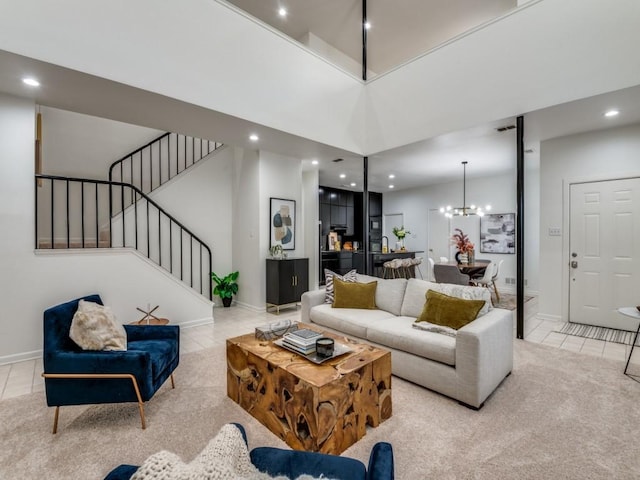 tiled living room featuring stairway, recessed lighting, an inviting chandelier, baseboards, and a towering ceiling