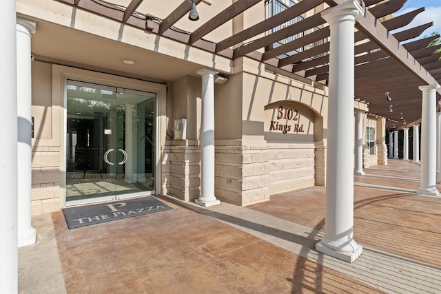 doorway to property with stucco siding