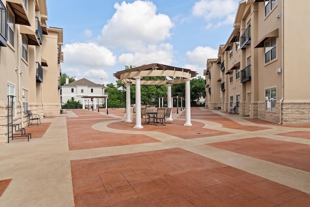 view of home's community featuring a pergola