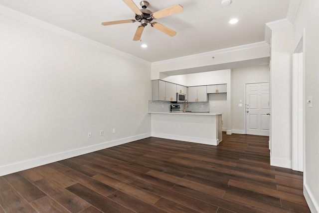 unfurnished living room with recessed lighting, dark wood-style flooring, crown molding, a ceiling fan, and baseboards