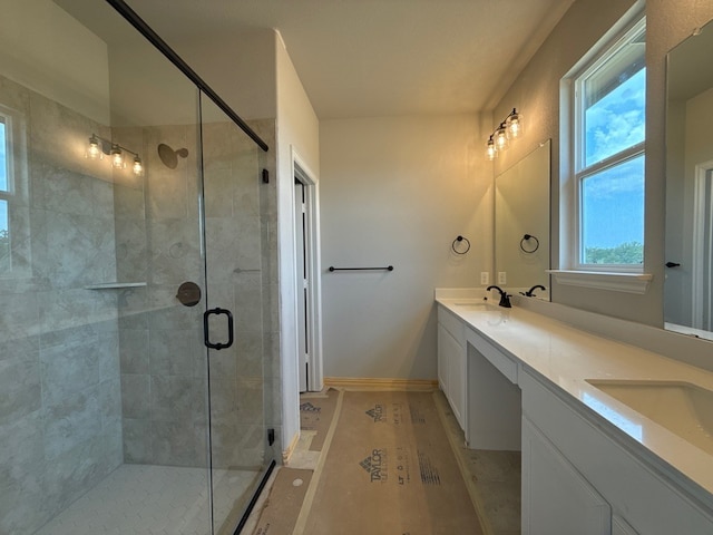 504 Ashlow Ct, Springtown, TX 76082 - bathroom featuring double vanity, a stall shower, and baseboards