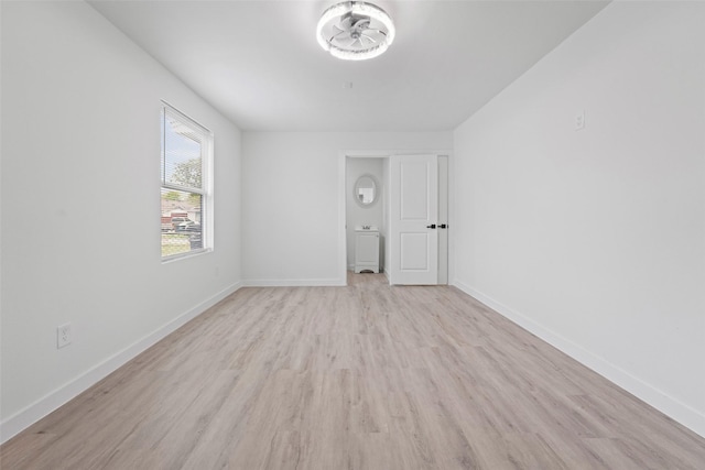 11534 Fernald Ave, Dallas, TX 75218 - unfurnished room featuring light wood finished floors and baseboards