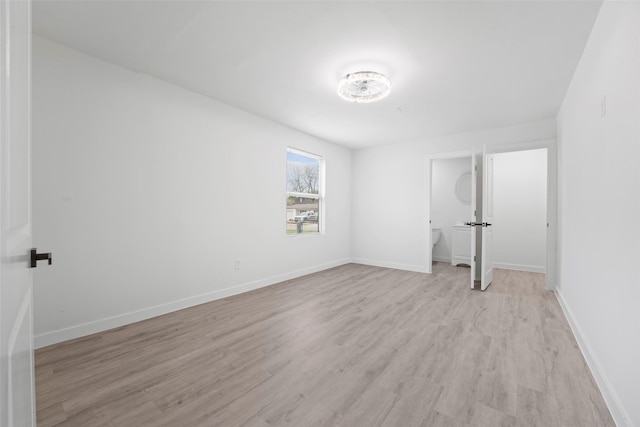 11534 Fernald Ave, Dallas, TX 75218 - unfurnished bedroom featuring light wood finished floors and baseboards