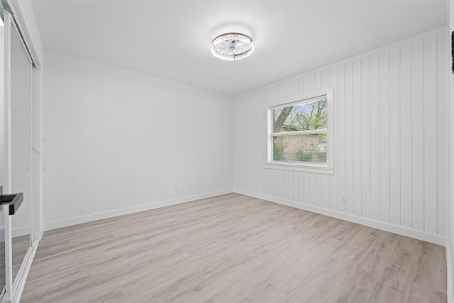 11534 Fernald Ave, Dallas, TX 75218 - empty room with light wood-style floors and baseboards