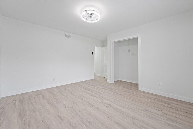 11534 Fernald Ave, Dallas, TX 75218 - unfurnished room with light wood-style flooring and baseboards