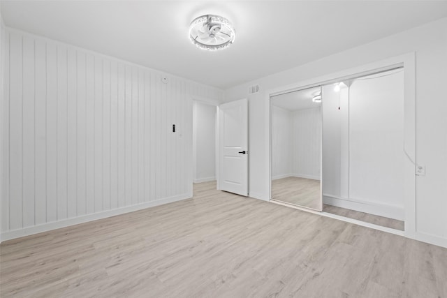 11534 Fernald Ave, Dallas, TX 75218 - unfurnished bedroom with wood finished floors, a closet, and baseboards