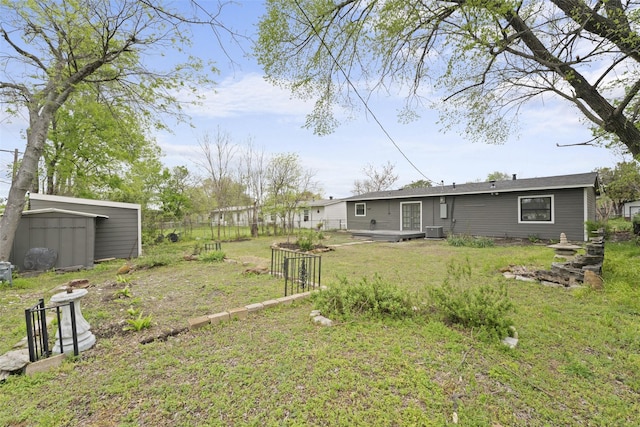 11534 Fernald Ave, Dallas, TX 75218 - view of yard featuring a shed, an outdoor structure, and central AC unit