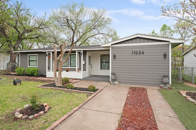 11534 Fernald Ave, Dallas, TX 75218 - ranch-style house featuring board and batten siding and a porch