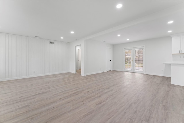 11534 Fernald Ave, Dallas, TX 75218 - unfurnished living room with recessed lighting, light wood-type flooring, and baseboards