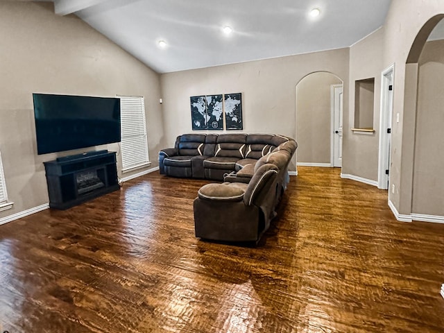 300 Cleve Cole Rd, Denison, TX 75021 - living room with arched walkways, wood finished floors, and baseboards