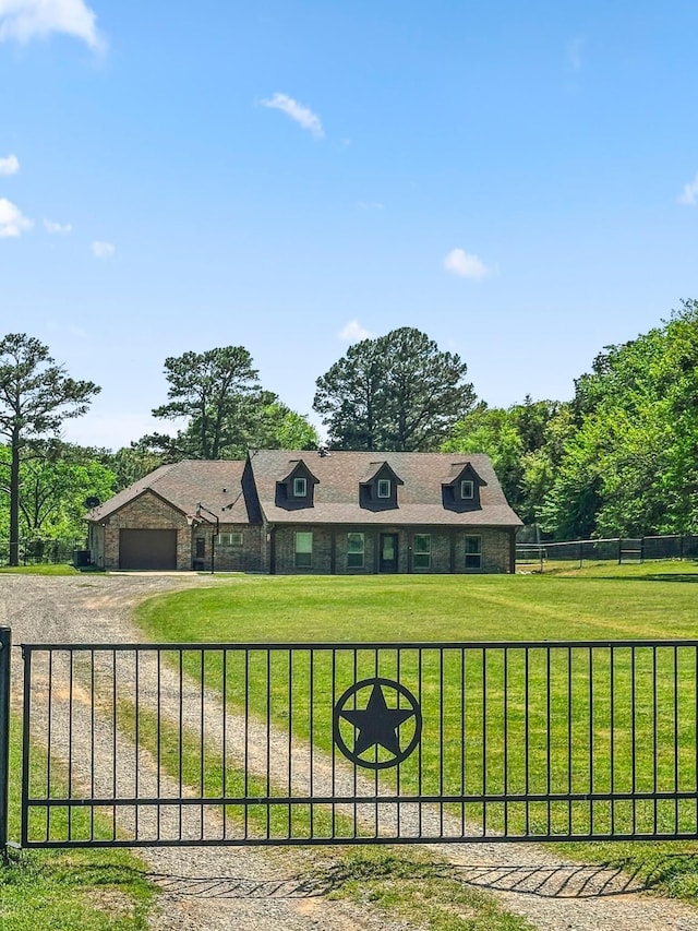 view of front of property featuring dirt driveway, stone siding, and an attached garage
