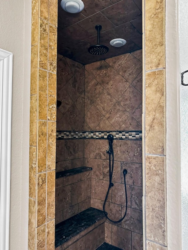 bathroom with tiled shower