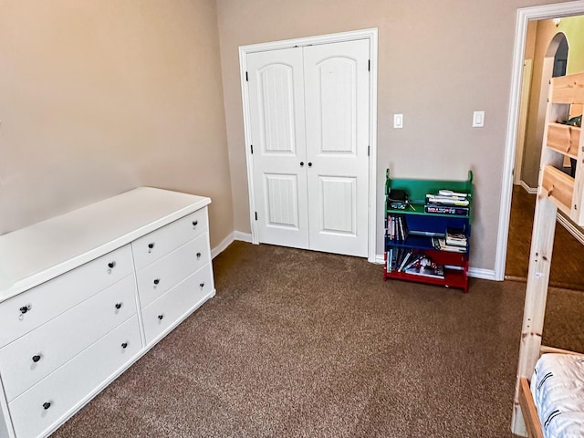 300 Cleve Cole Rd, Denison, TX 75021 - bedroom with dark carpet, baseboards, and a closet