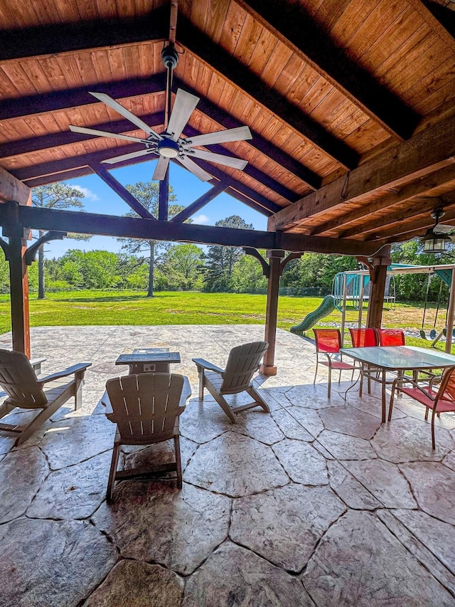 view of patio / terrace featuring a gazebo, a ceiling fan, and a playground