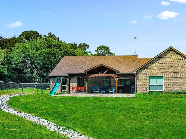 300 Cleve Cole Rd, Denison, TX 75021 - back of property with a playground, a patio, brick siding, and a shingled roof