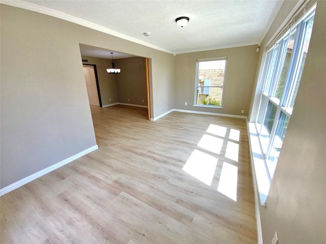1332 Burmeister Rd, Fort Worth, TX 76134 - unfurnished room featuring crown molding, a textured ceiling, baseboards, and wood finished floors