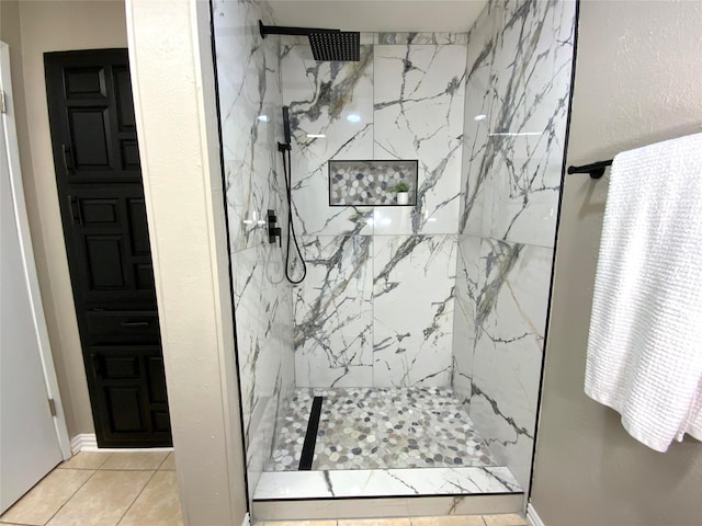 1332 Burmeister Rd, Fort Worth, TX 76134 - bathroom featuring baseboards, a marble finish shower, and tile patterned flooring