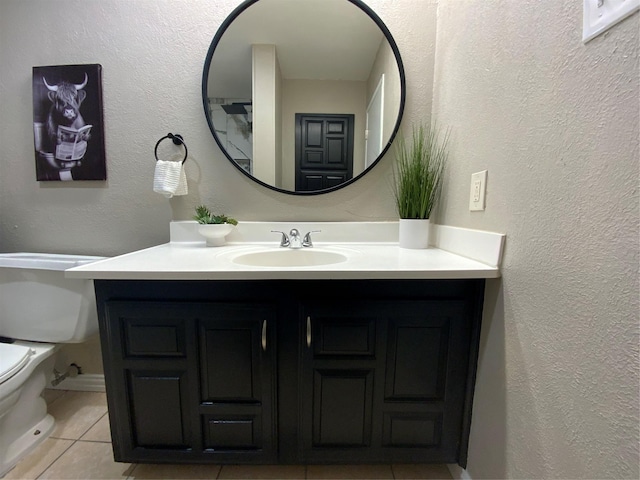 1332 Burmeister Rd, Fort Worth, TX 76134 - half bathroom with a textured wall, toilet, tile patterned flooring, and vanity