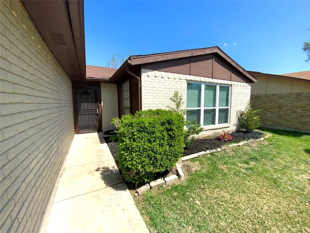 1332 Burmeister Rd, Fort Worth, TX 76134 - doorway to property featuring a lawn, fence, and brick siding