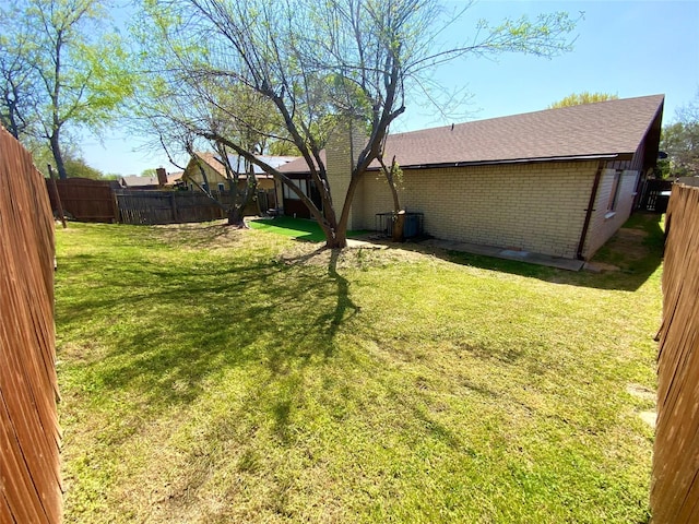 1332 Burmeister Rd, Fort Worth, TX 76134 - view of yard featuring a fenced backyard and central AC