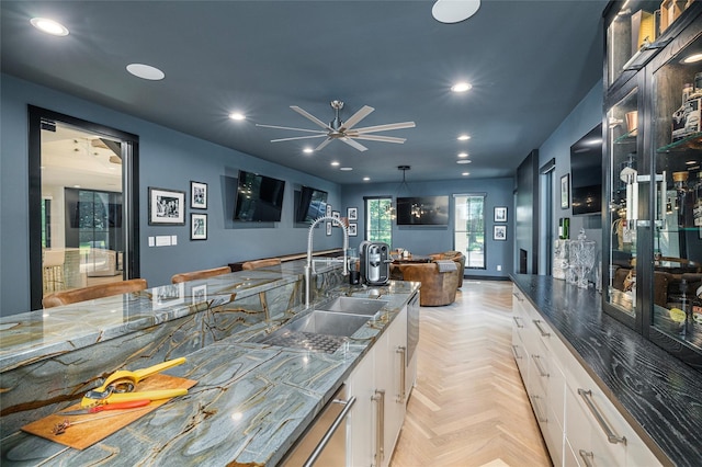 3512 Willow Bend Dr, Plano, TX 75093 - kitchen with glass insert cabinets, recessed lighting, white cabinets, a sink, and stone counters