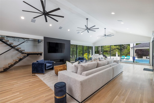 3512 Willow Bend Dr, Plano, TX 75093 - living area featuring beam ceiling, high vaulted ceiling, light wood-style flooring, stairs, and a ceiling fan