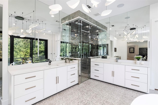3512 Willow Bend Dr, Plano, TX 75093 - full bathroom featuring a sink, an inviting chandelier, a stall shower, and two vanities
