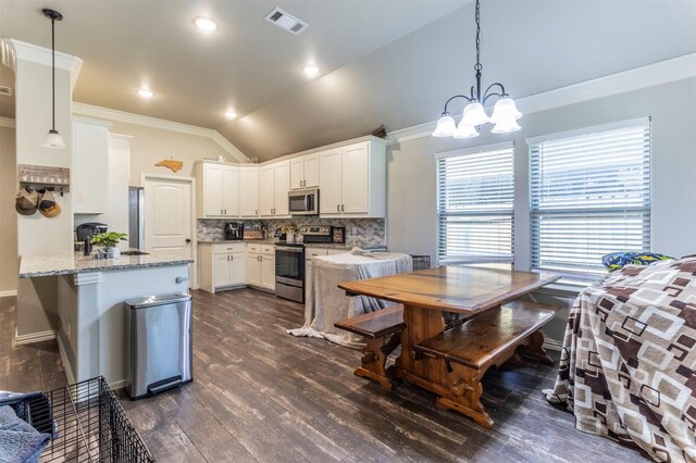 2024 Castleberry Cut-Off Rd, Fort Worth, TX 76114 - kitchen featuring vaulted ceiling, tasteful backsplash, stainless steel appliances, visible vents, and ornamental molding