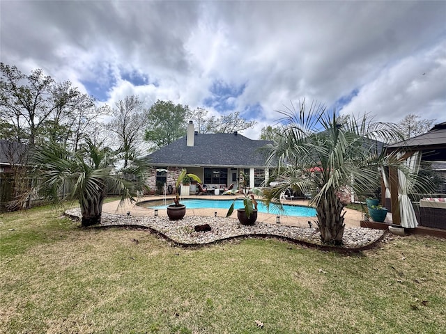 pool featuring central air condition unit, a yard, and a patio area